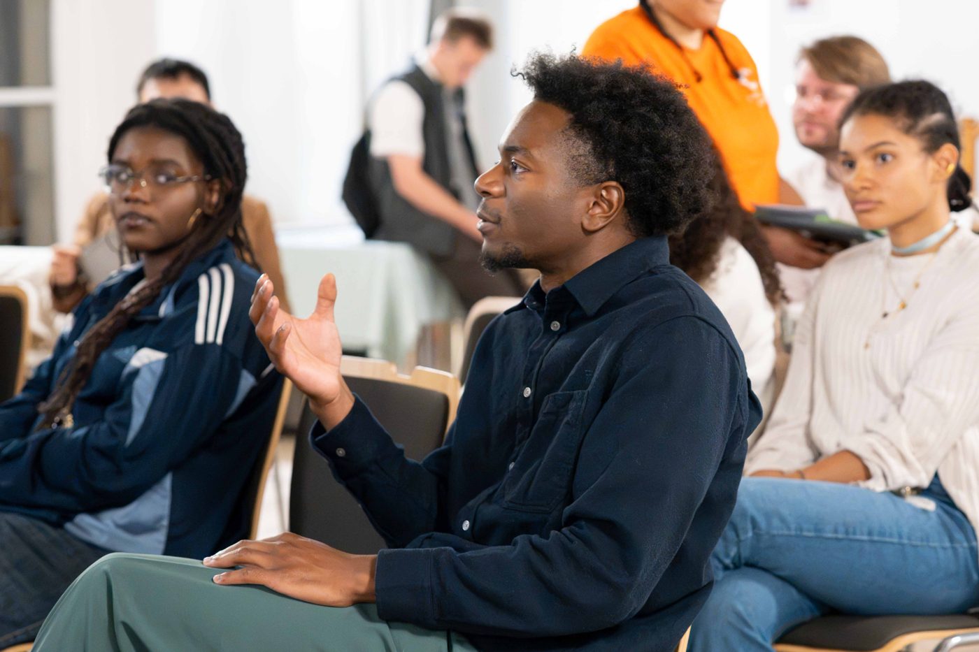 Young adults talking at a Dedicate screening in France