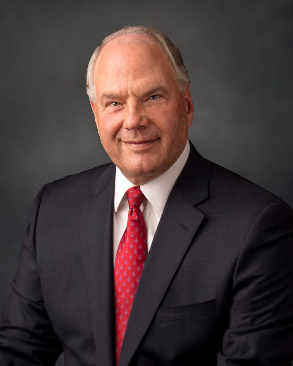Portrait of Elder Ronald A. Rasband in a dark suit and red tie